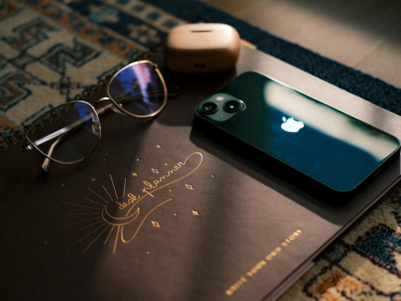 Minimalist desk setup with green plant and soft light