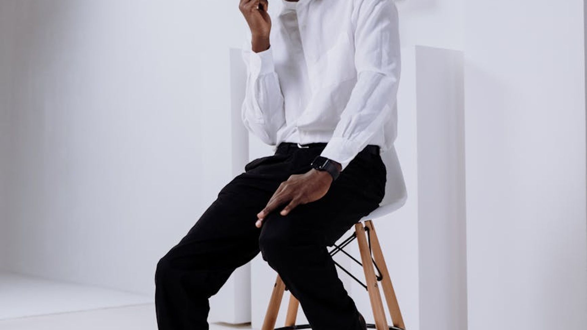 Person looking into the distance in a bright modern office