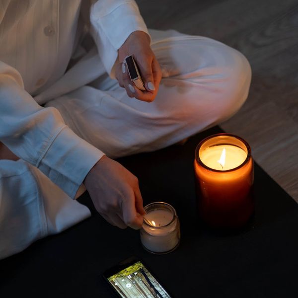 Person practicing meditation in a clean white space
